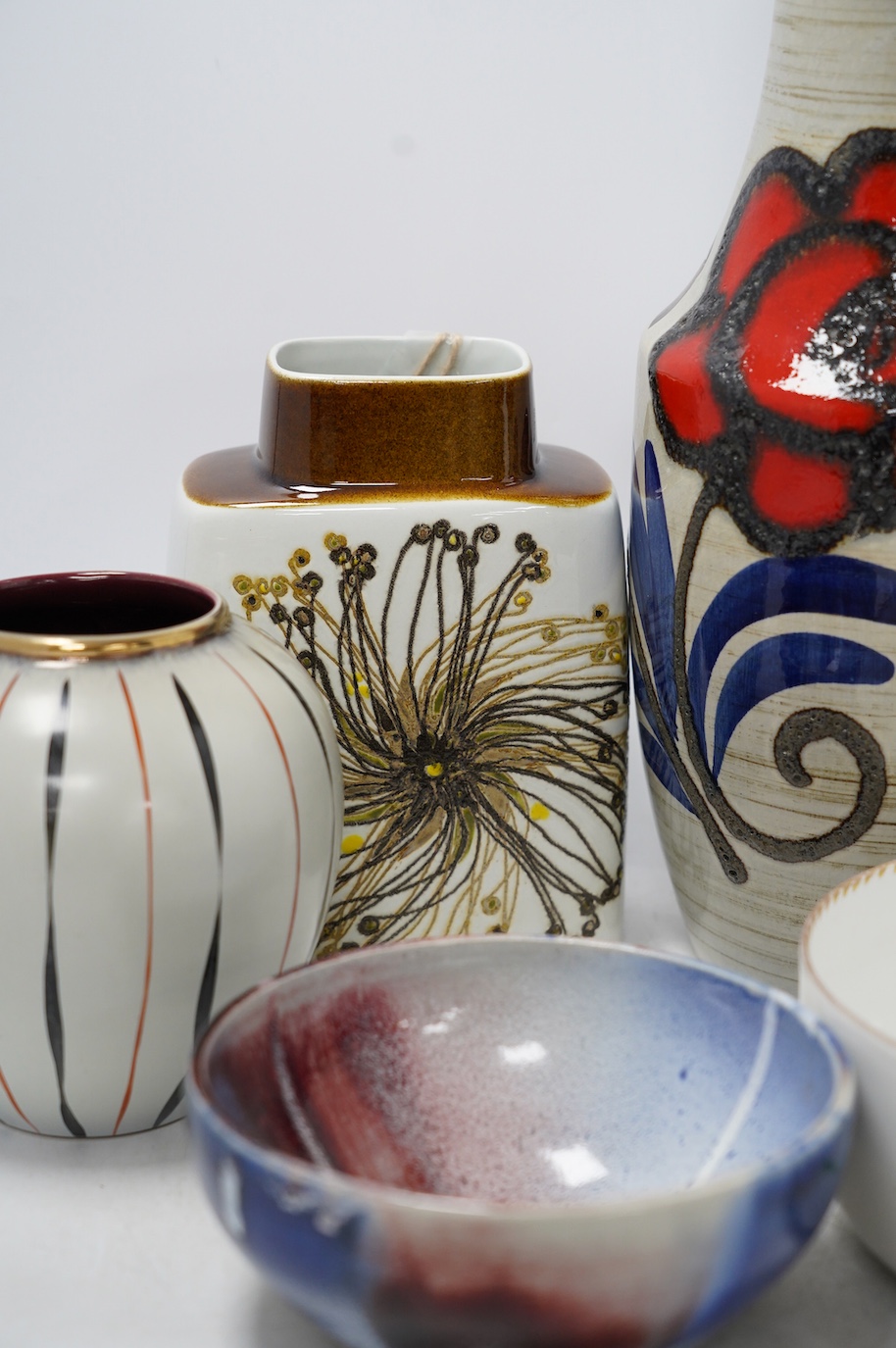 Five ceramic items including a Royal Copenhagen vase, 19cm, two West German vases, tallest 34.5cm, a studio pottery bowl and a Dresden bowl. Condition - good